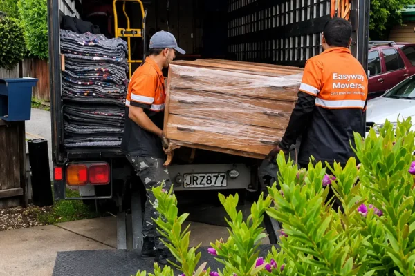 Professional home movers in Christchurch loading furniture into a moving truck